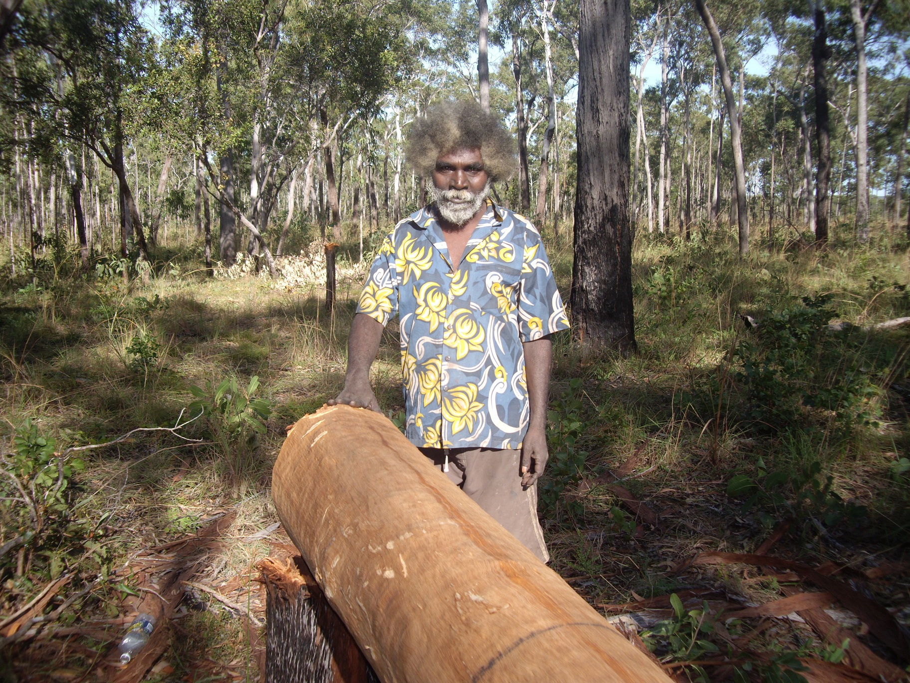 3. James Iyuna chopping hollow log